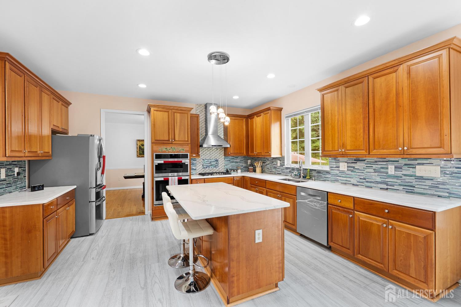 Eat-in kitchen with island and stainless steel appliances at 74 Macfarlane Circle