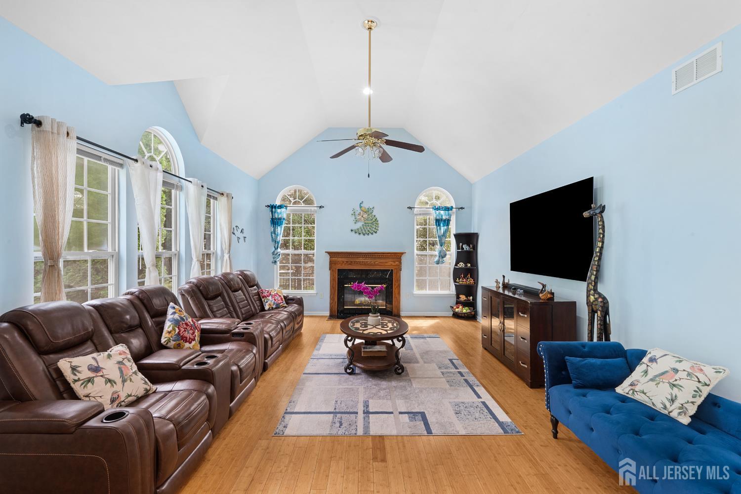 Family room with wood-burning fireplace at 74 Macfarlane Circle