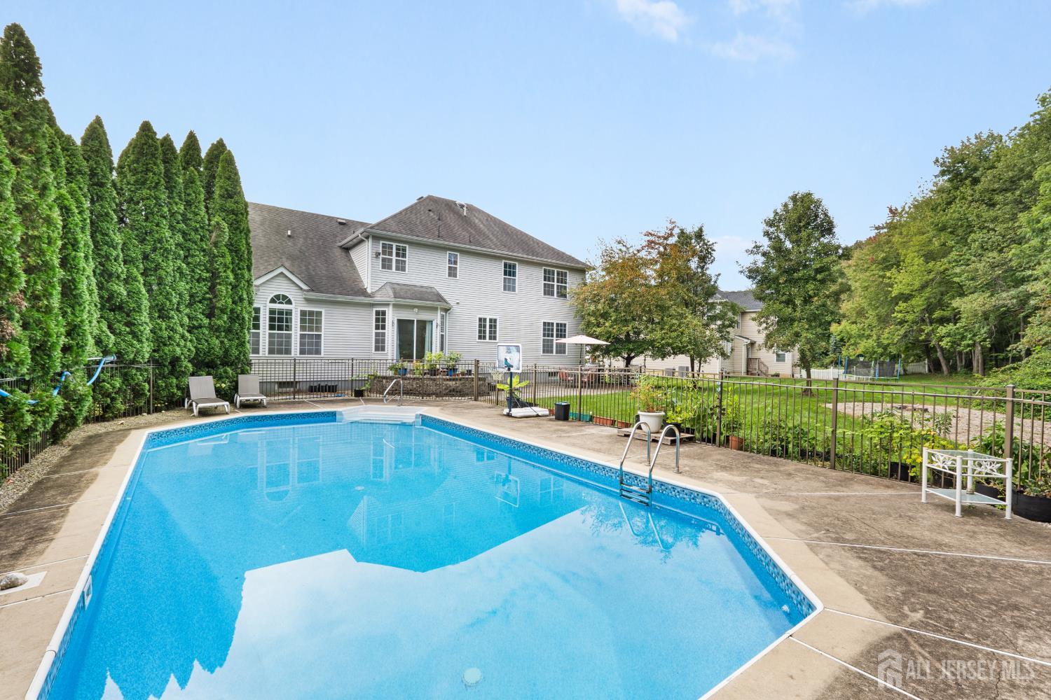 Heated in-ground saltwater pool and backyard at 74 Macfarlane Circle
